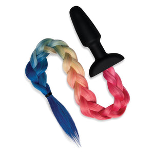 A black butt plug with a tail in rainbow colors