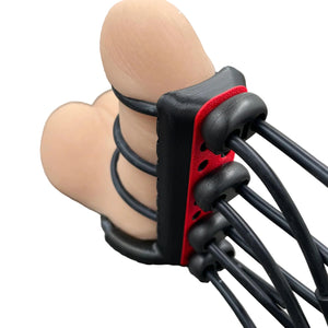 Een e-stim BDSM toy voor de penis met straps - met dildo als voorbeeld