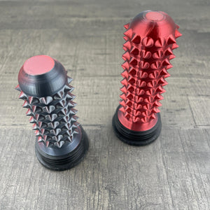Een rood met zwarte stimming-tool voor autisme en overprikkeling