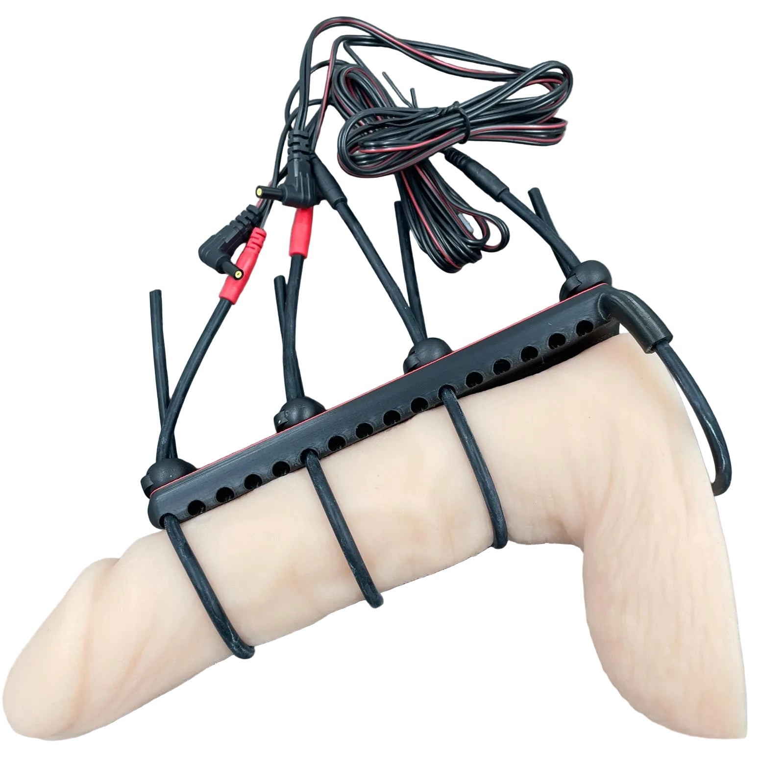 Een e-stim BDSM toy voor de penis met straps - met dildo als voorbeeld