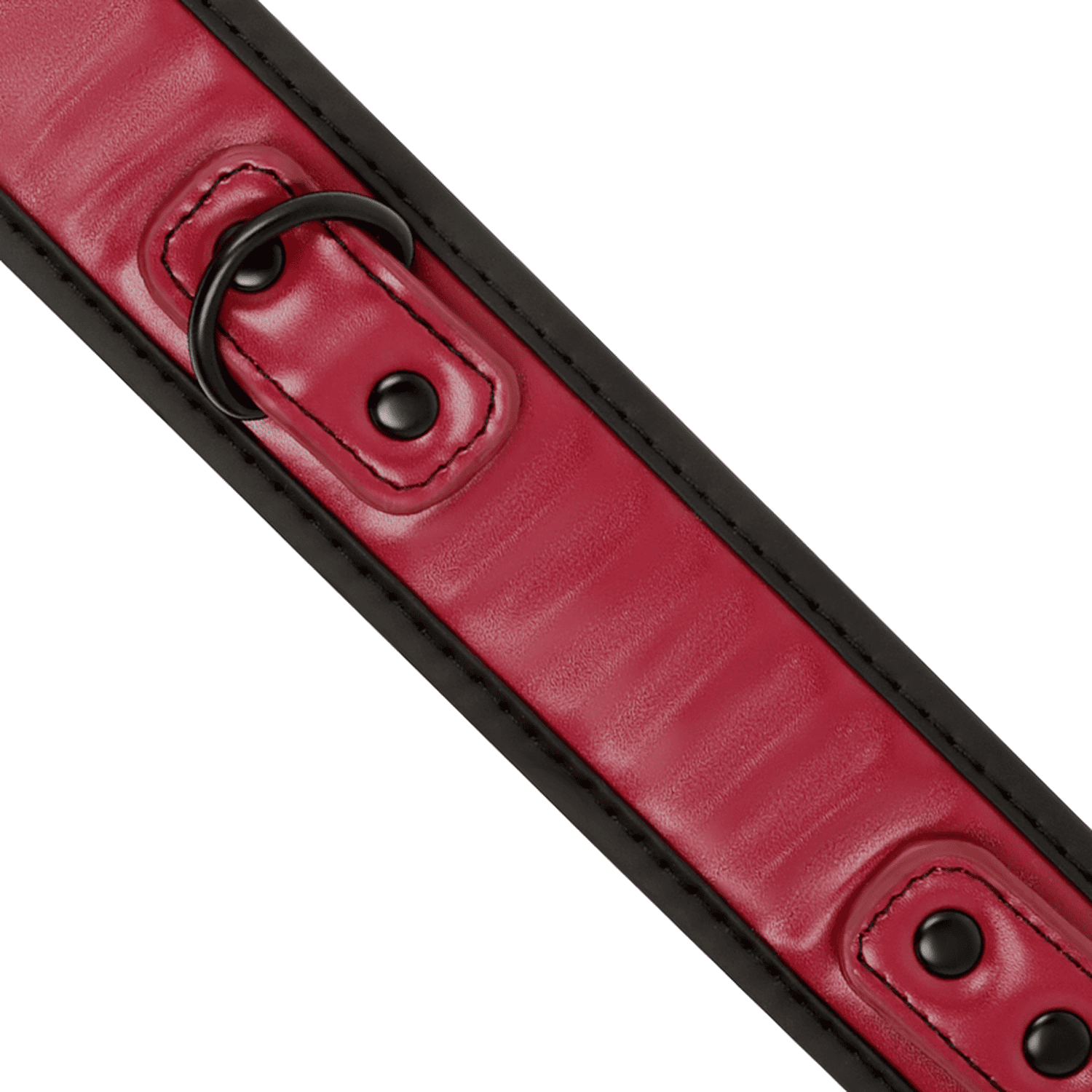 Detail shot of a BDSM collar with leash made from vegan leather in red and black colour